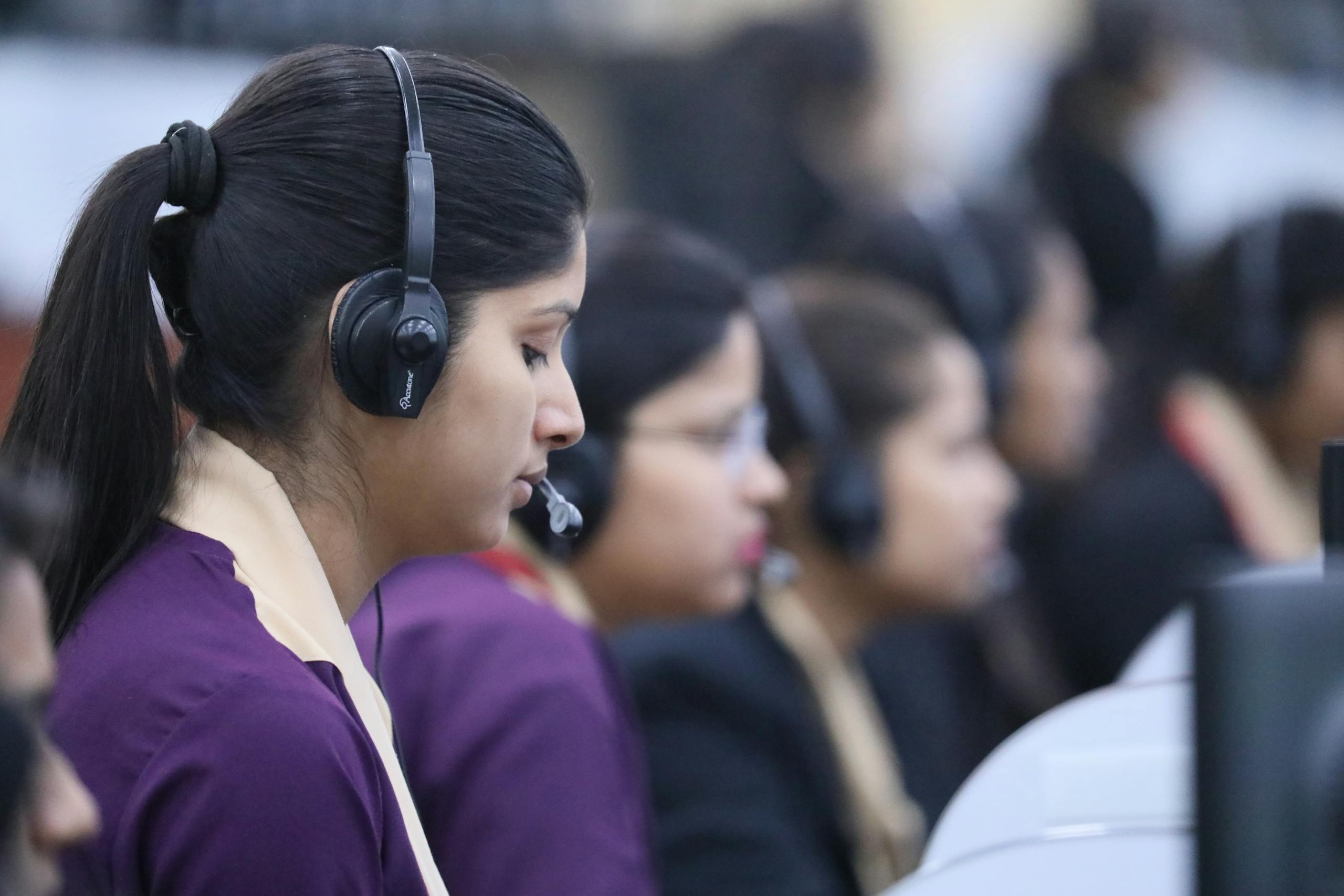 A Woman Wearing Black Headset